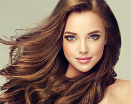 Brunette-girl-with-long-and-shiny-wavy-hair-.-Beautiful-model-with-curly-hairstyle-..jpg